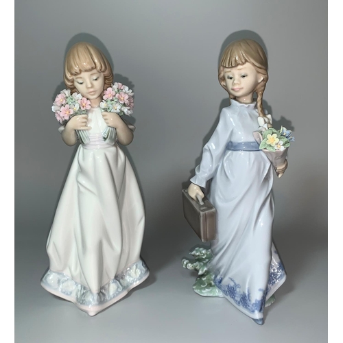 15 - Two Lladro figures - a young girl with pigtails, long dress, holding a bunch of lowers and small sui... 
