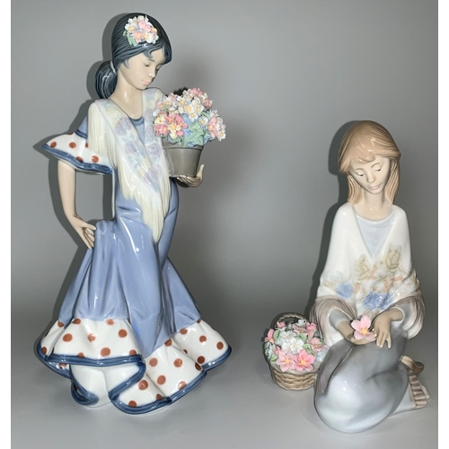 19 - A Lladro figure of A Spanish girl with flowers; a Lladro figure of a seated girl with basket of flow... 