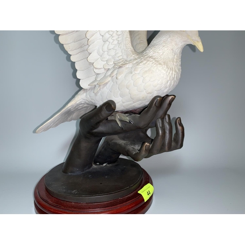 44 - Jose de Casasola bronze & resin group hands holding a dove with outstretched wings, Ltd Edition 382/... 