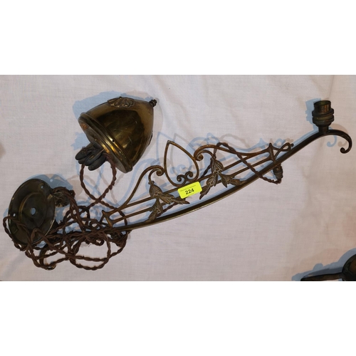 224 - An Edwardian brass twin sconce rise and fall ceiling light