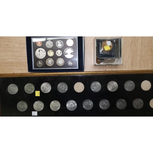 409 - A GB 2005 Battle of Trafalgar proof set containing 2 x £5 crowns, a framed selection of Churchill cr... 