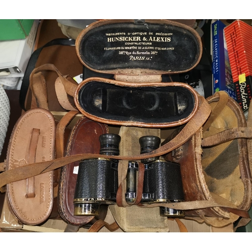 530 - A pair of early 20th century brass military binoculars by HUNSICKER & ALEXIS cased; 4 various binocu... 