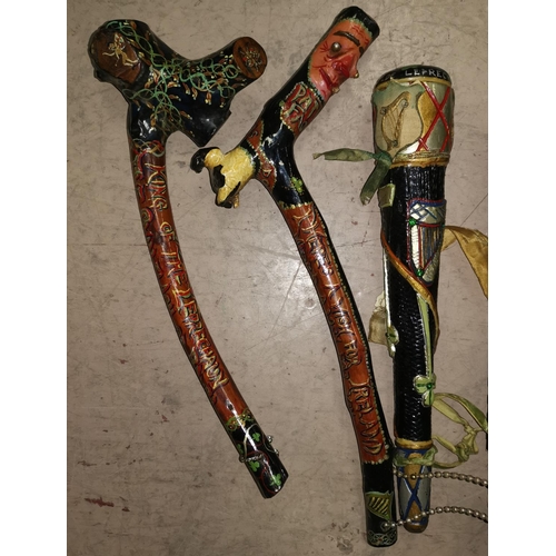 532 - Two printed Irish blackthorn shillelagh and a similar cosh 12 - 15 inches