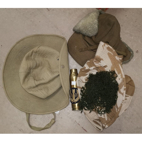 534 - A stitched canvas broad rim dessert hat (labelled SEMA), a brass shell case with Bomb Disposal badge... 