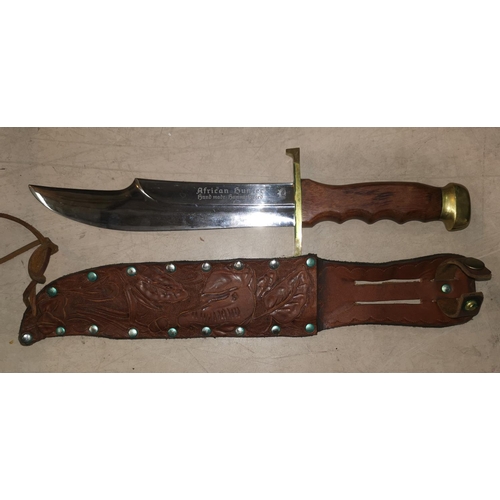 569 - A modern German manufactured hunting knife by Carl Schlieper, 21cm blade
