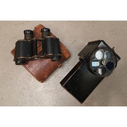 572 - A British Admiralty signalling lantern pattern no 1038 and a pair of cased binoculars