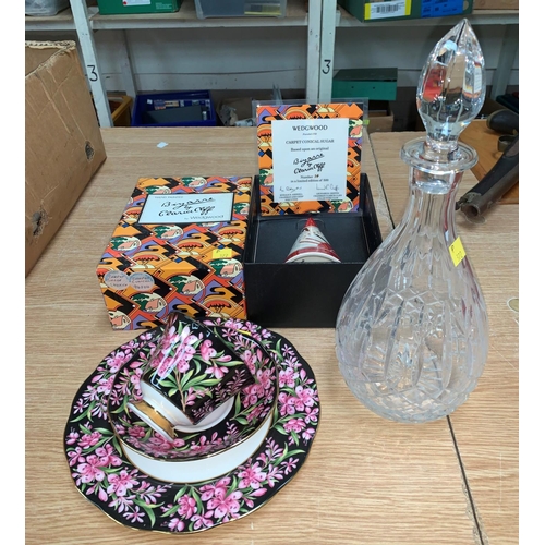 102 - A Wedgwood reproduction Clarice Cliff conical sugar with box and certificate, a decanter and a trio ... 
