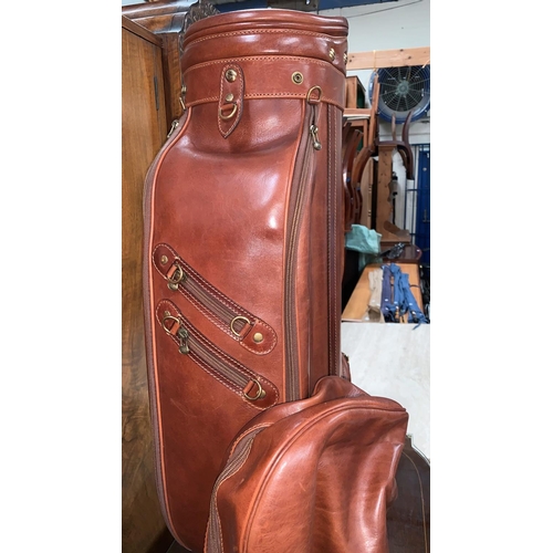 707 - An unused The Bridge golf bag with hood in brown hide, tags still attached.