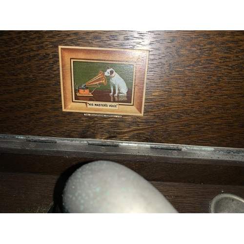 687 - An HMV oak cased table top wind up gramaphone
