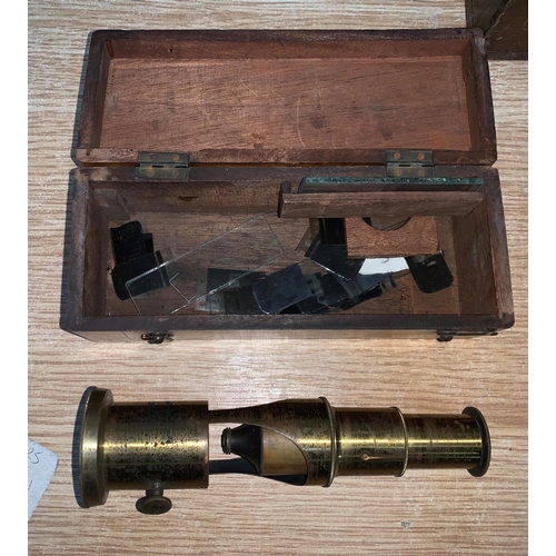 737 - A mahogany boxed late 19th century/early 20th century brass field microscope