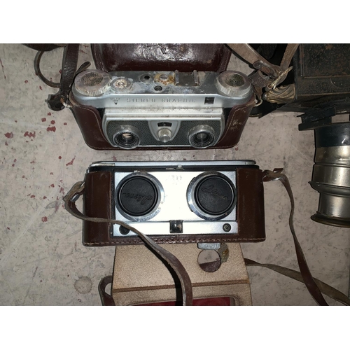 738 - 2 stereographic cameras; an Ensign box camera; a 1950's Danset radio; a small magic lantern