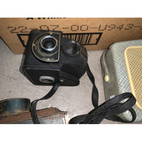 738 - 2 stereographic cameras; an Ensign box camera; a 1950's Danset radio; a small magic lantern