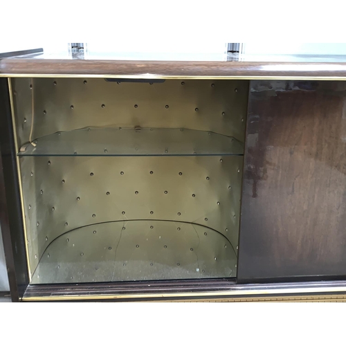 692 - A 1950's Blaupunkt 'Blue Spot' radiogram unit with cocktail section, with mirrored and studded decor... 
