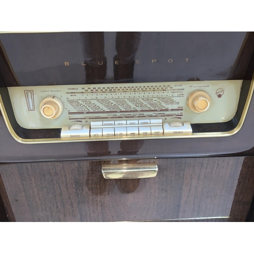 692 - A 1950's Blaupunkt 'Blue Spot' radiogram unit with cocktail section, with mirrored and studded decor... 