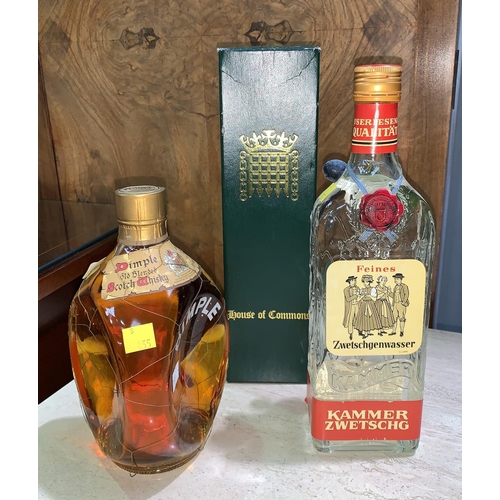 696 - A HAIGS Dimple bottle of whisky, 26 2/3 fl oz; a bottle of House of Commons 12 year old whisky boxed... 