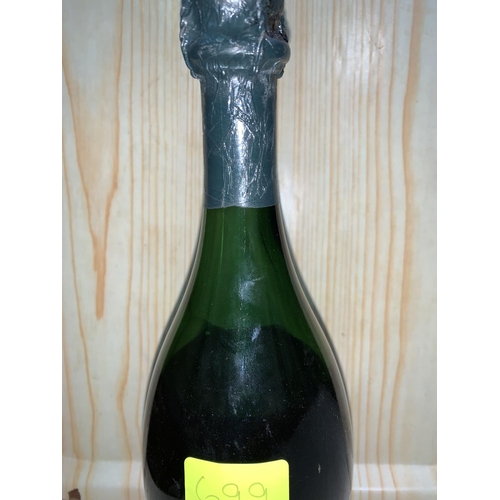 699 - A bottle of Moet et Chandon Champagne; Cuvee Dom Perignon 1964 (couple of inches down neck)