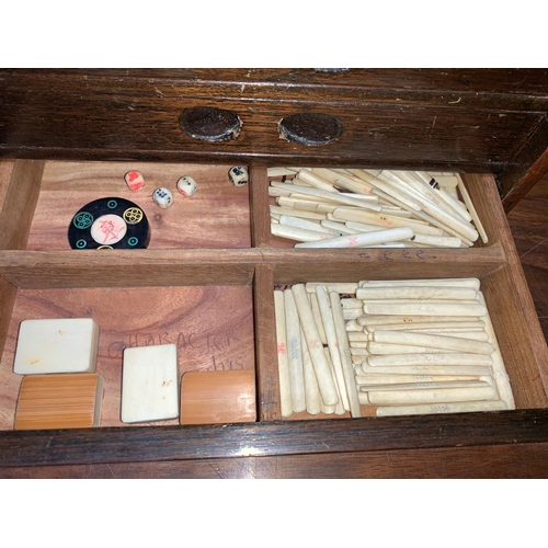782 - A Chinese Mah Jong chest fitted 5 drawers with a selection of bone and bamboo tiles and other playin... 