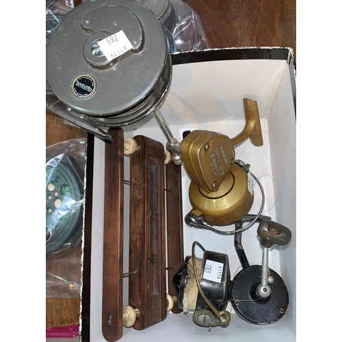 783 - Four vintage fishing rods, 3 reels and a hand line