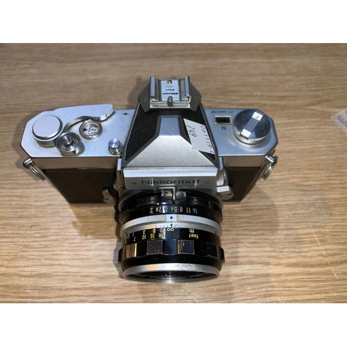 749 - A Nikon Nikkormat FT3727158 Camera and a lens no.
750729