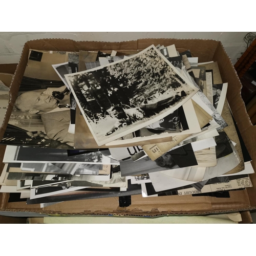 519 - A quantity of black & white press photographs; a selection of books