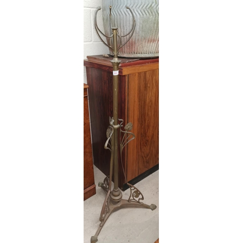 387 - An Art Nouveau brass telescopic oil lamp column; a companion set; etc.