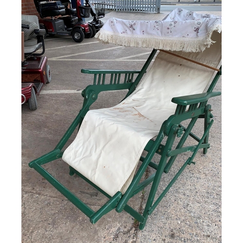 625 - A late 19th/early 20th century patented folding sunchair with cover, green painted