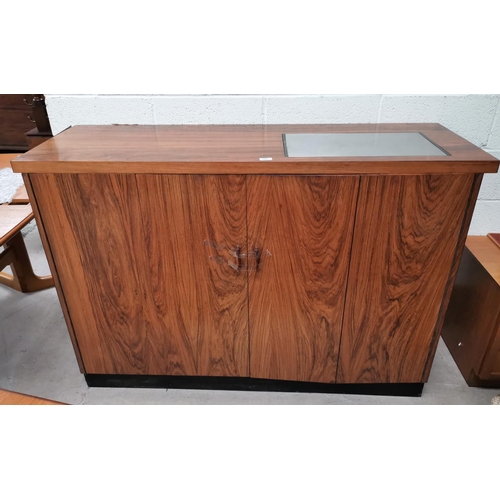 646 - A 1970's Danish rosewood side cabinet/serving table, the top inset stainless steel hotplate, 58