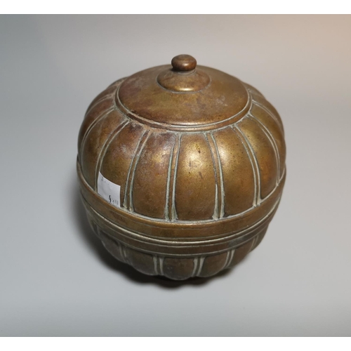 121 - A Mughal Indian brass betel nut container of ribbed gourd form, 15 cm