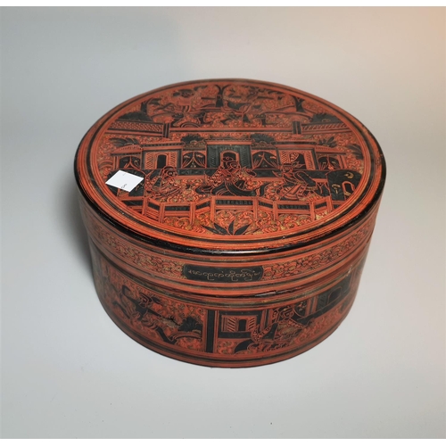 122 - A 19th century Burmese red lacquer circular box and cover, with figural decoration on black ground, ... 