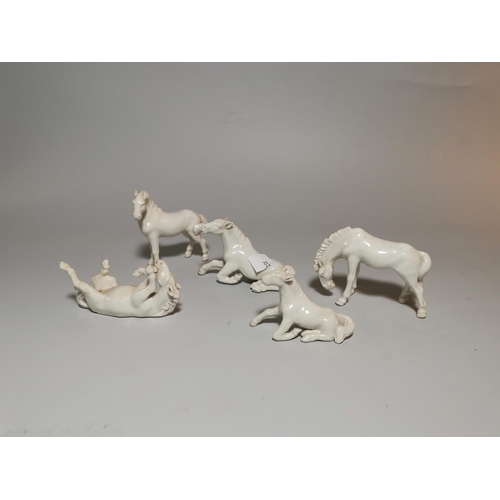 129 - Chinese blanc de chine:  a group of 5 horse figures, width 8 cm