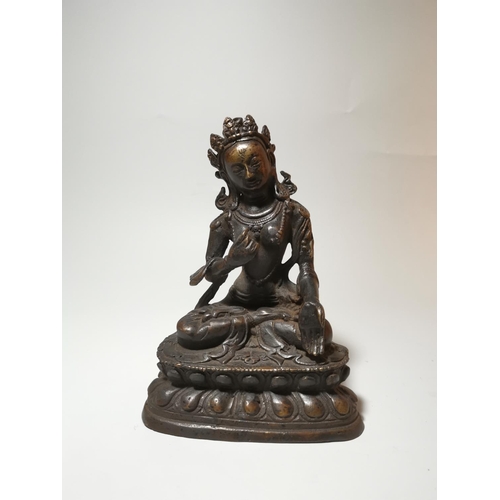 131a - A Far Eastern gilt bronze figure of Buddha in  the lotus position, height 19 cm, possibly Thai