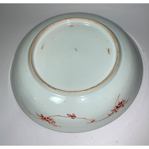 291a - A Chinese Kangxi shallow dish decorated with prancing horse, flowers and trees, in burnt orange, gre... 