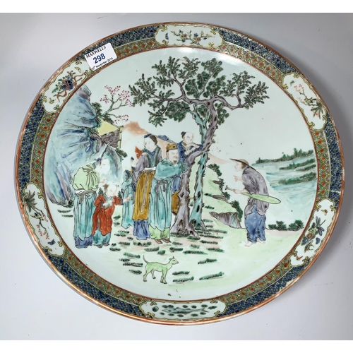 298 - A 19th century Chinese Cantonese shallow dish decorated in polychrome with figures by a tree, 4 char... 