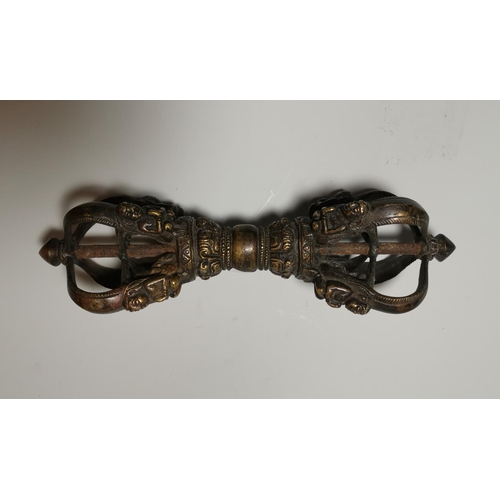 130b - A Tibetan cast and gilded bronze ritual sceptre decorated with figures in relief, length 23 cm