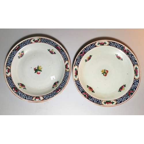 131 - A 19th century pair of Chinese porcelain shallow dishes, blue & white trellis borders decorated with... 