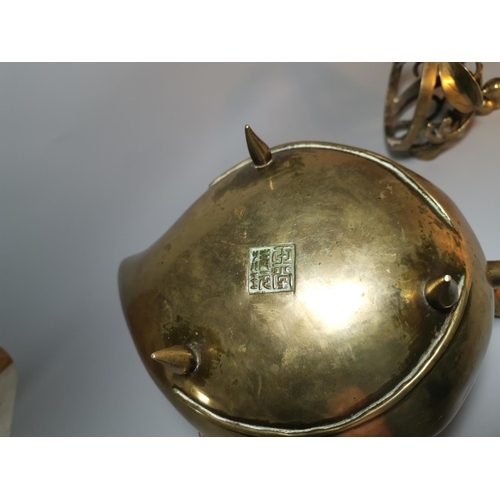 121c - A Chinese large brass incense burner of peach form, the domed lid with open scrollwork branch and le... 