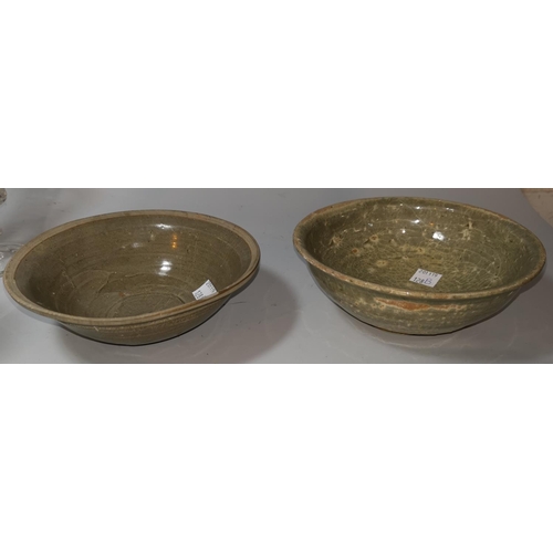 128b - A South East Asian footed bowl with typical brown  glaze, 15.5 cm; a similar bowl
