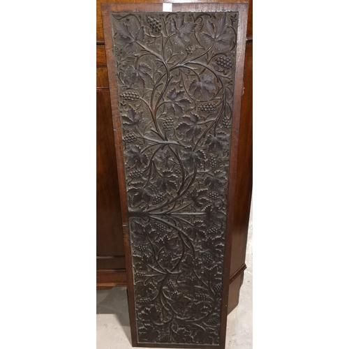 133b - A late 19th/early 20th century Indian hardwood panel with all over carved decoration of fruiting vin... 