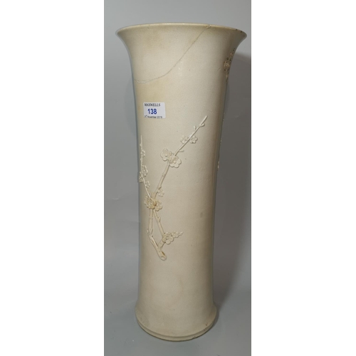 138 - A 19th century blanc de chine cylindrical vase with flared rim, relief prunus branch decoration and ... 