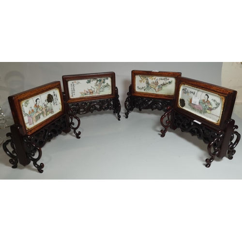 263 - A Chinese porcelain set of 4 table screens, each decorated with genre scenes, carved frames with scr... 