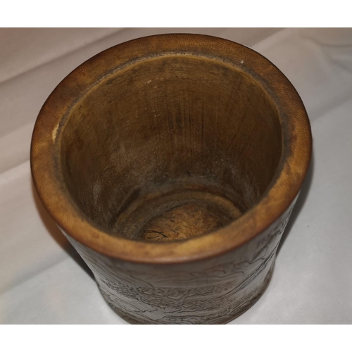 335 - A Chinese bamboo brush pot with light relief carving of a landscape, height 11 cm