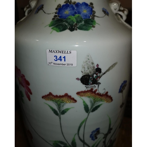 341 - A large mid 19th century Chinese famille rose rouleau shape vase decorated with exotic flowers and i... 