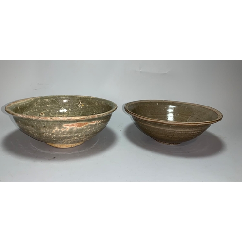 128b - A South East Asian footed bowl with typical brown  glaze, 15.5 cm; a similar bowl