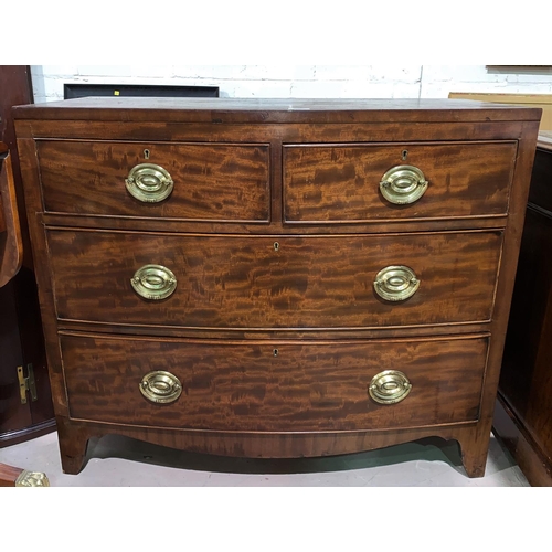532 - A 19th century mahogany bow front chest of 2 long and 2 short drawers with brass drop handles, on br... 