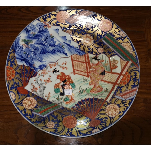240a - A late 19th/early 20th century Imari dish depicting dancing figures