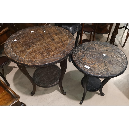 266 - An oriental circular table carved to the top with a dragon; another larger table