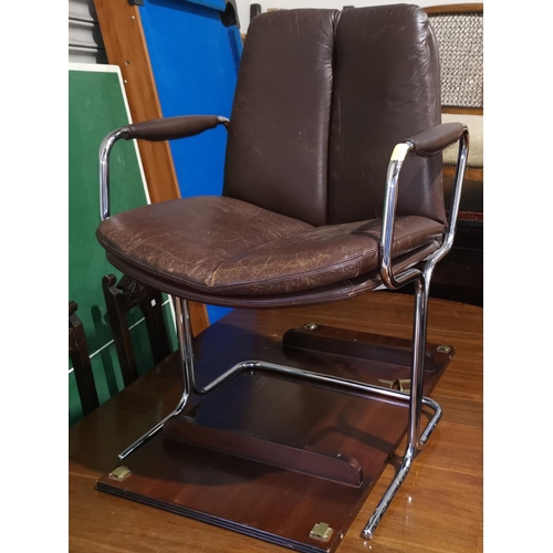 657 - A mid century Italian designer armchair in chrome and leather by Castelli