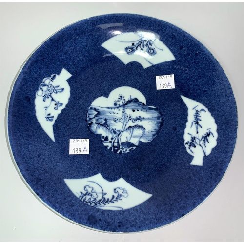 139a - A Chinese Kiangsi blue & white shallow dish decorated with fan and leaf reserve panels against a mot... 