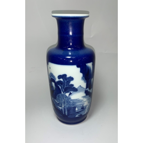 146 - A Chinese Kangxi rouleau shaped blue and white vase, the reserve panels decorated with a landscape a... 