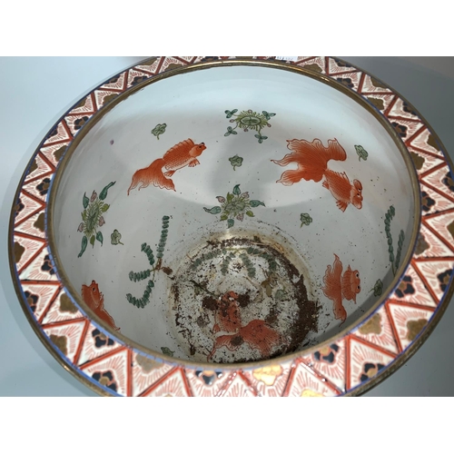 267 - A Chinese porcelain goldfish bowl n wooden stand, diameter 30 cm